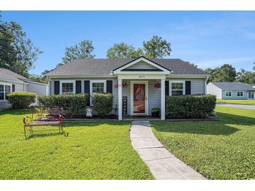 Charming single story home featuring a well manicured front yard and cozy entrance at 6570 Pebble Beach Crescent, Myrtle Beach, SC 29588