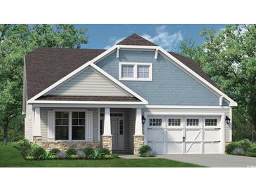Charming home showcasing a mix of stone, clapboard and shingle siding, and a two-car garage at 1196 Halter Pl., Calabash, NC 28467