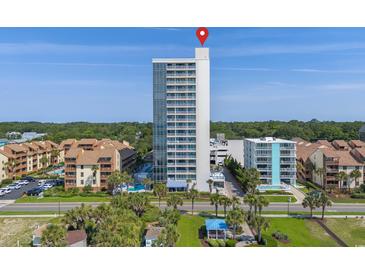 Stunning oceanfront condominium with pools, palm trees, manicured lawns, and panoramic views of the coastline at 5511 N Ocean Blvd. # 1801, Myrtle Beach, SC 29577