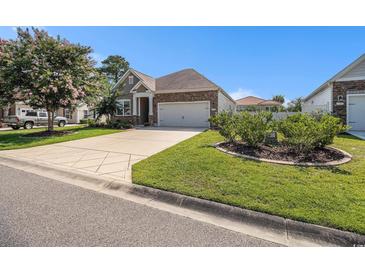 Charming home exterior with stone accents, inviting curb appeal, and a well-maintained lawn at 1301 Camlet Ln., Little River, SC 29566