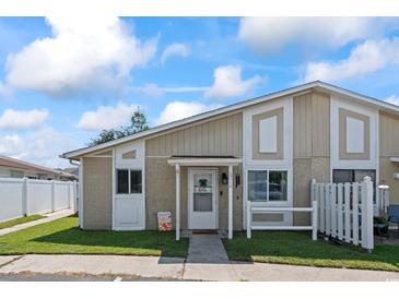 Charming townhouse with tidy landscaping, neutral tones, and inviting curb appeal at 1311 Turkey Ridge Rd. # A, Surfside Beach, SC 29575