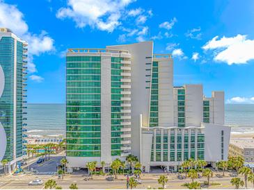 An impressive exterior view of the resort, capturing its multi-story architecture and oceanfront location with palm trees at 201 S Ocean Blvd. # 616, Myrtle Beach, SC 29577