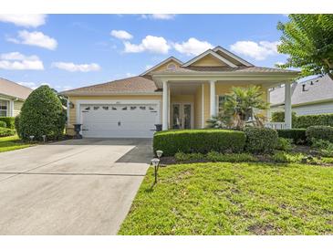 Charming single-Gathering home with a well-manicured lawn, two-car garage and beautiful curb appeal at 492 Grand Cypress Way, Murrells Inlet, SC 29576
