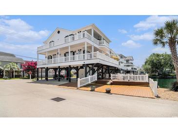 Beautiful multi-level beach house featuring multiple decks and ample outdoor living space on the water at 6001-R11 S Kings Hwy., Myrtle Beach, SC 29575