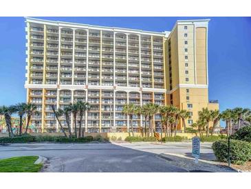 Beautiful multi-story condo building featuring multiple balconies and manicured landscaping at 6900 N Ocean Blvd. # 734, Myrtle Beach, SC 29572