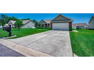 Charming single-story home featuring a two-car garage, well-manicured lawn, and a concrete driveway in a friendly neighborhood at 365 Lenox Dr., Conway, SC 29526