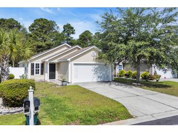 Charming single-story home with attached garage and well-maintained landscaping at 1077 Stoney Falls Blvd., Myrtle Beach, SC 29579