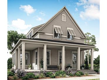 Charming two-story home featuring a welcoming front porch with classic columns and a well-manicured lawn at 1627 Sayebrook Pkwy., Myrtle Beach, SC 29588