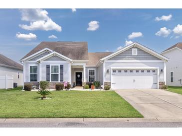 Charming single-story home with a well-maintained lawn, inviting curb appeal, and an attached two car garage at 1725 Boyne Dr., Myrtle Beach, SC 29588