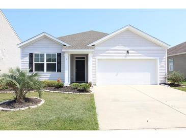 Charming single-story home with well-maintained landscaping and an attached two-car garage at 2681 Ophelia Way, Myrtle Beach, SC 29577