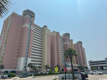 Large beachside condominium with palm trees, parking, and pedestrian crossing at 2801 S Ocean Blvd. # 1535, North Myrtle Beach, SC 29582