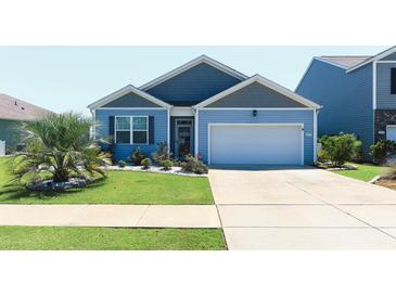 Charming single-Gathering home with a well-manicured lawn, a two-car garage, and inviting curb appeal at 2979 Skylark Dr., Myrtle Beach, SC 29577
