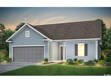 Charming single-story home with a neatly manicured lawn, attached garage and beautiful light blue siding at 319 River Edge Dr., Myrtle Beach, SC 29588