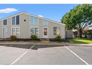Inviting home featuring unique windows, a well-maintained yard, and reserved parking at 800 9Th Ave. S # N-1, North Myrtle Beach, SC 29582