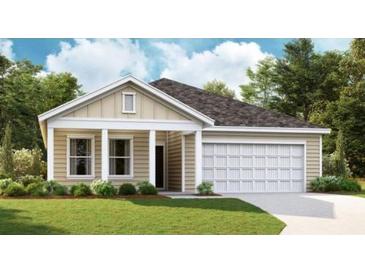 Charming single-story home featuring a two-car garage and a well-manicured front lawn at 176 Valerio St., Myrtle Beach, SC 29579