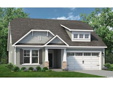 Charming single-Gathering home with a two-car garage, a landscaped yard and classic architectural details at 2166 Gooseberry Way, Longs, SC 29568