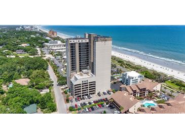 An aerial view shows a high-rise building with ocean views and a beautiful beach at 5523 N Ocean Blvd. # 1412, Myrtle Beach, SC 29577