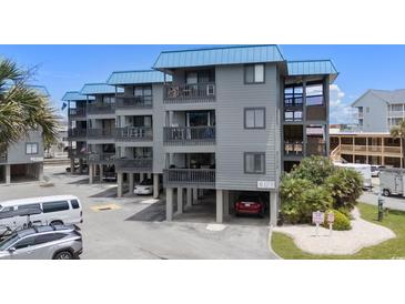 Beach condo complex offers covered parking and spacious balconies with ocean views, perfect for coastal living at 6001 N Ocean Blvd. # 137, North Myrtle Beach, SC 29582