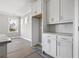 Modern kitchen with sleek white cabinets and stainless steel appliances, perfect for cooking at 112 Waterway Crossing Ct., Little River, SC 29566