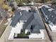 Aerial view of a sprawling home with a dark roof, a backyard pool, and well-kept surroundings at 4302 Gray Heron Dr., North Myrtle Beach, SC 29582