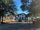 New construction featuring a modern home with stone accents and a well-manicured front yard at 4302 Gray Heron Dr., North Myrtle Beach, SC 29582