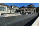 View of outdoor pool with modern design, stone, and black tiling at 4302 Gray Heron Dr., North Myrtle Beach, SC 29582