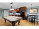 Finished basement with a kitchenette, pool table, and bar table with beautiful hardwood flooring at 1262 Limestone St., Murrells Inlet, SC 29576