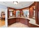 Bathroom highlighting a spacious vanity with a marble countertop and elegant wood cabinetry at 1262 Limestone St., Murrells Inlet, SC 29576