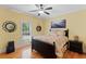 Bright bedroom featuring hardwood floors, a ceiling fan, and a window with plantation shutters at 1262 Limestone St., Murrells Inlet, SC 29576