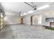 Large garage featuring bright lighting, storage cabinets, and a clean, organized space at 1262 Limestone St., Murrells Inlet, SC 29576