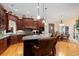 Beautiful kitchen featuring dark wood cabinets, granite countertops, and a breakfast bar with seating at 1262 Limestone St., Murrells Inlet, SC 29576