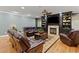 Cozy living room with a fireplace, built-in shelving, and comfortable leather seating at 1262 Limestone St., Murrells Inlet, SC 29576