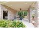 Covered patio with brick columns, ceiling fan, and outdoor seating provides relaxing outdoor space at 1262 Limestone St., Murrells Inlet, SC 29576