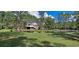 Spacious backyard with a pond and lush green grass at 7101 Choppee Rd., Georgetown, SC 29440