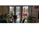 Deck with red chairs and umbrella, accessible from dining room at 7101 Choppee Rd., Georgetown, SC 29440