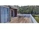 Wooden deck with a table and chairs, overlooking the yard at 7101 Choppee Rd., Georgetown, SC 29440