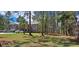 Brick home with a large yard and mature trees at 7101 Choppee Rd., Georgetown, SC 29440