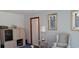 Living room with a wingback chair and built-in shelving at 7101 Choppee Rd., Georgetown, SC 29440