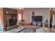 Living room features a fireplace and large TV at 7101 Choppee Rd., Georgetown, SC 29440