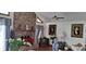 Living room with brick fireplace and large artwork at 7101 Choppee Rd., Georgetown, SC 29440