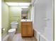 Bright bathroom featuring a wooden vanity, tiled flooring, and a shower/tub with a white curtain at 2301 S Ocean Blvd. # 621, Myrtle Beach, SC 29577