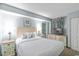 Cozy bedroom with Queen bed, wall art, television, and ample storage at 2301 S Ocean Blvd. # 621, Myrtle Beach, SC 29577