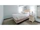 Bright bedroom with Queen size bed, carpet, end tables, and soft lamps at 2301 S Ocean Blvd. # 621, Myrtle Beach, SC 29577