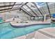 Modern indoor pool area with a lazy river, hot tubs, and a translucent roof at 2301 S Ocean Blvd. # 621, Myrtle Beach, SC 29577