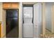 A laundry closet equipped with a stacked washer and dryer unit, complemented by a full-sized refrigerator at 2301 S Ocean Blvd. # 621, Myrtle Beach, SC 29577