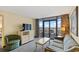 Comfortable living room with balcony access provides stunning ocean views, complemented by stylish furnishings at 2301 S Ocean Blvd. # 621, Myrtle Beach, SC 29577