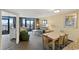 Open-concept living room and dining area showcasing beautiful ocean views from a private balcony at 2301 S Ocean Blvd. # 621, Myrtle Beach, SC 29577