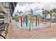 Interactive water park featuring colorful play structures, palm trees, and lounge chairs at 2301 S Ocean Blvd. # 621, Myrtle Beach, SC 29577