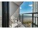 Relaxing balcony with a bottle of wine and view of ocean, beach and community pool at 1501 S Ocean Blvd. # 1048, Myrtle Beach, SC 29577