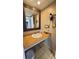 Bathroom featuring a vanity with sink, large mirror, and essential amenities at 1501 S Ocean Blvd. # 1048, Myrtle Beach, SC 29577